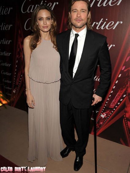 Brad Pitt Walks With A Cane On The Red Carpet